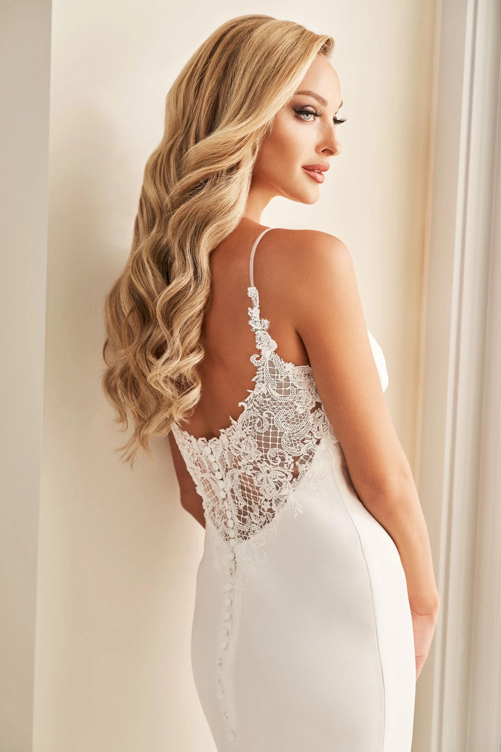 Model wearing a Flattering Back Style gown. Desktop image
